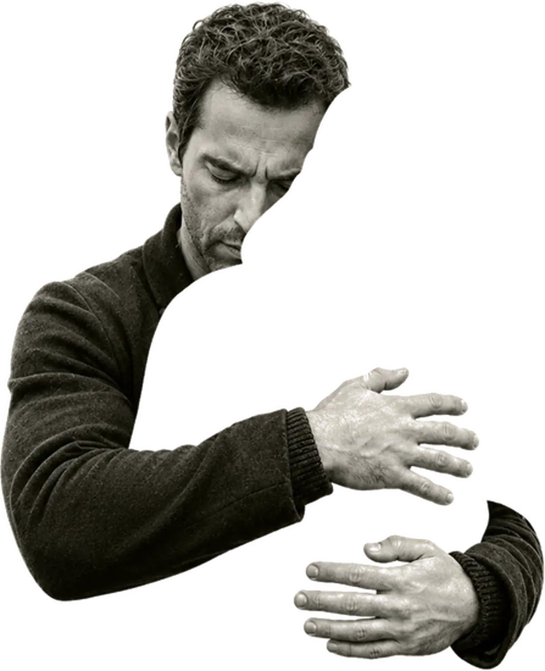 A man leaning over an empty surface, both hands open on it.